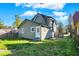 House back view with green siding and yard at 3616 N College Ave, Indianapolis, IN 46205