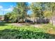 Large backyard with a wooden fence at 3616 N College Ave, Indianapolis, IN 46205