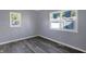 Bright bedroom with hardwood floors and large windows at 3616 N College Ave, Indianapolis, IN 46205