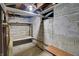 Unfinished basement with built-in shelving at 3616 N College Ave, Indianapolis, IN 46205