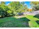 Large backyard with grassy area and wooden fence at 3616 N College Ave, Indianapolis, IN 46205