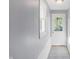 Bright hallway with white door and grey walls at 3616 N College Ave, Indianapolis, IN 46205