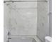 Clean bathroom with marble-tiled shower and tub at 3616 N College Ave, Indianapolis, IN 46205