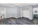 Spacious bedroom with gray walls and hardwood floors at 3616 N College Ave, Indianapolis, IN 46205
