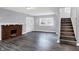 Living room with fireplace, hardwood floors and staircase at 3616 N College Ave, Indianapolis, IN 46205