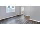 Bedroom with hardwood floors and neutral gray walls at 3616 N College Ave, Indianapolis, IN 46205
