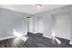 Bedroom with grey walls, wood-look flooring, and double closets at 3616 N College Ave, Indianapolis, IN 46205
