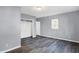 Simple bedroom with gray walls, hardwood floors, and a closet at 3616 N College Ave, Indianapolis, IN 46205