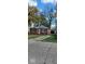 Brick ranch home with attached garage, and a spacious front yard at 4529 Crittenden Ave, Indianapolis, IN 46205