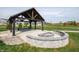 Community fire pit with seating and landscaping at 2298 Pine Valley Dr, Plainfield, IN 46168