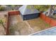 Backyard with detached garage and wooden fence at 3752 Ruckle St, Indianapolis, IN 46205