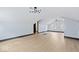 Bright bonus room featuring hardwood floors and stylish light fixtures at 3752 Ruckle St, Indianapolis, IN 46205