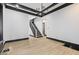 Living room with hardwood floors, a staircase, and elegant chandelier at 3752 Ruckle St, Indianapolis, IN 46205