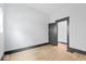 Spacious bedroom with light gray walls and wood-look flooring at 3752 Ruckle St, Indianapolis, IN 46205