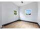 Charming bedroom with two windows and wood-look flooring at 3752 Ruckle St, Indianapolis, IN 46205