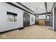 Bright living room with hardwood floors, a fireplace, and front door view at 3752 Ruckle St, Indianapolis, IN 46205