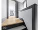 Modern staircase with gray trim and light wood steps at 3752 Ruckle St, Indianapolis, IN 46205