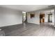 Open concept living room with kitchen view and grey flooring at 19420 Golden Meadow Way, Noblesville, IN 46060