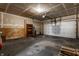 Unfinished garage with overhead door and shelving at 19420 Golden Meadow Way, Noblesville, IN 46060