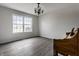 Spacious living room with large window and hardwood floors at 19420 Golden Meadow Way, Noblesville, IN 46060