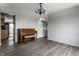 Living room featuring hardwood floors and a view into the kitchen at 19420 Golden Meadow Way, Noblesville, IN 46060
