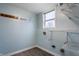 Bright laundry room with built-in shelving and vinyl flooring at 19420 Golden Meadow Way, Noblesville, IN 46060