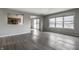 Living room with large windows and grey flooring at 19420 Golden Meadow Way, Noblesville, IN 46060