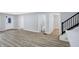Living area with hardwood floors and half bath at 1327 N Gale St, Indianapolis, IN 46201