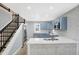 Modern kitchen with blue cabinets and white counters at 1327 N Gale St, Indianapolis, IN 46201