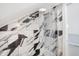 Black and white marble shower with glass enclosure and modern fixtures at 1327 N Gale St, Indianapolis, IN 46201