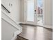 Modern entryway with stairs and wood-look floors at 1817 N New Jersey St, Indianapolis, IN 46202