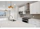 Bright kitchen with stainless steel appliances and white shaker cabinets at 1817 N New Jersey St, Indianapolis, IN 46202