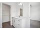 Simple bathroom with white vanity and walk-in closet at 1817 N New Jersey St, Indianapolis, IN 46202
