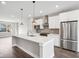 Modern kitchen with stainless steel appliances and white cabinets at 1817 N New Jersey St, Indianapolis, IN 46202