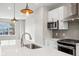 Sleek kitchen design with white cabinets and quartz countertops at 1817 N New Jersey St, Indianapolis, IN 46202