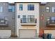 Rear view of townhome with attached garage at 1817 N New Jersey St, Indianapolis, IN 46202