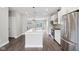 Modern kitchen with island, stainless steel appliances, and white cabinetry at 1817 N New Jersey St, Indianapolis, IN 46202