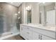 Modern bathroom with double vanity, large shower, and grey tile at 1817 N New Jersey St, Indianapolis, IN 46202