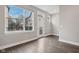 Bright living room with hardwood floors and access to balcony at 1817 N New Jersey St, Indianapolis, IN 46202
