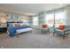Spacious main bedroom with blue bedding and sitting area at 236 Sam Himsel Way, Danville, IN 46122