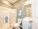 Bathroom with white vanity, glass shower, and patterned walls at 236 Sam Himsel Way, Danville, IN 46122