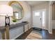 Bright entryway with decorative mirror, console table, and stylish floor at 236 Sam Himsel Way, Danville, IN 46122
