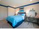 Well-lit bedroom featuring blue bedding and a desk area at 236 Sam Himsel Way, Danville, IN 46122