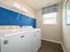 Convenient laundry room with washer, dryer, and shelving at 236 Sam Himsel Way, Danville, IN 46122