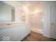 Bathroom with double vanity, marble shower, and modern fixtures at 2298 Pine Valley Dr, Plainfield, IN 46168
