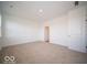 Simple bedroom with neutral carpeting and access to bathroom at 2298 Pine Valley Dr, Plainfield, IN 46168