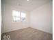 Spacious bedroom with neutral carpeting and large window at 2298 Pine Valley Dr, Plainfield, IN 46168
