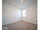 Bright bedroom with carpeted floors and a window at 2298 Pine Valley Dr, Plainfield, IN 46168