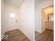 Bright entryway with hardwood floors and powder room at 2298 Pine Valley Dr, Plainfield, IN 46168
