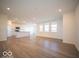 Open kitchen with island and hardwood floors at 2298 Pine Valley Dr, Plainfield, IN 46168